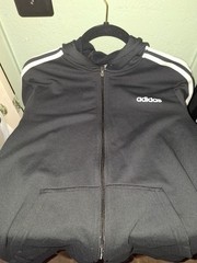 This is an Adidas Essentials Fleece 3-Stripes Full-Zip Hoodie in black with…
